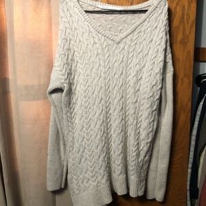 Cable knit asymmetrical sweater